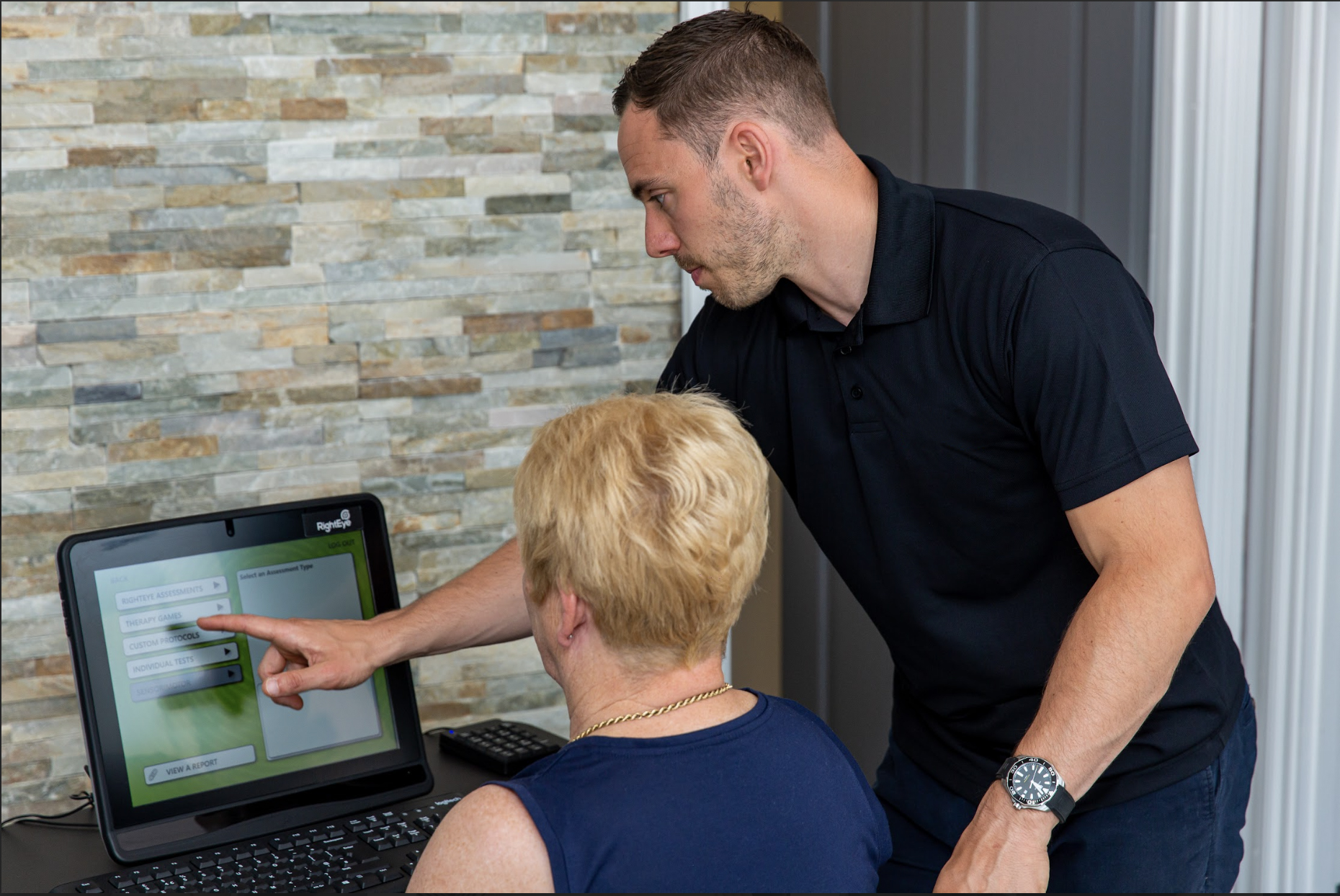 Torus Health practitioner guiding a client through a health assessment