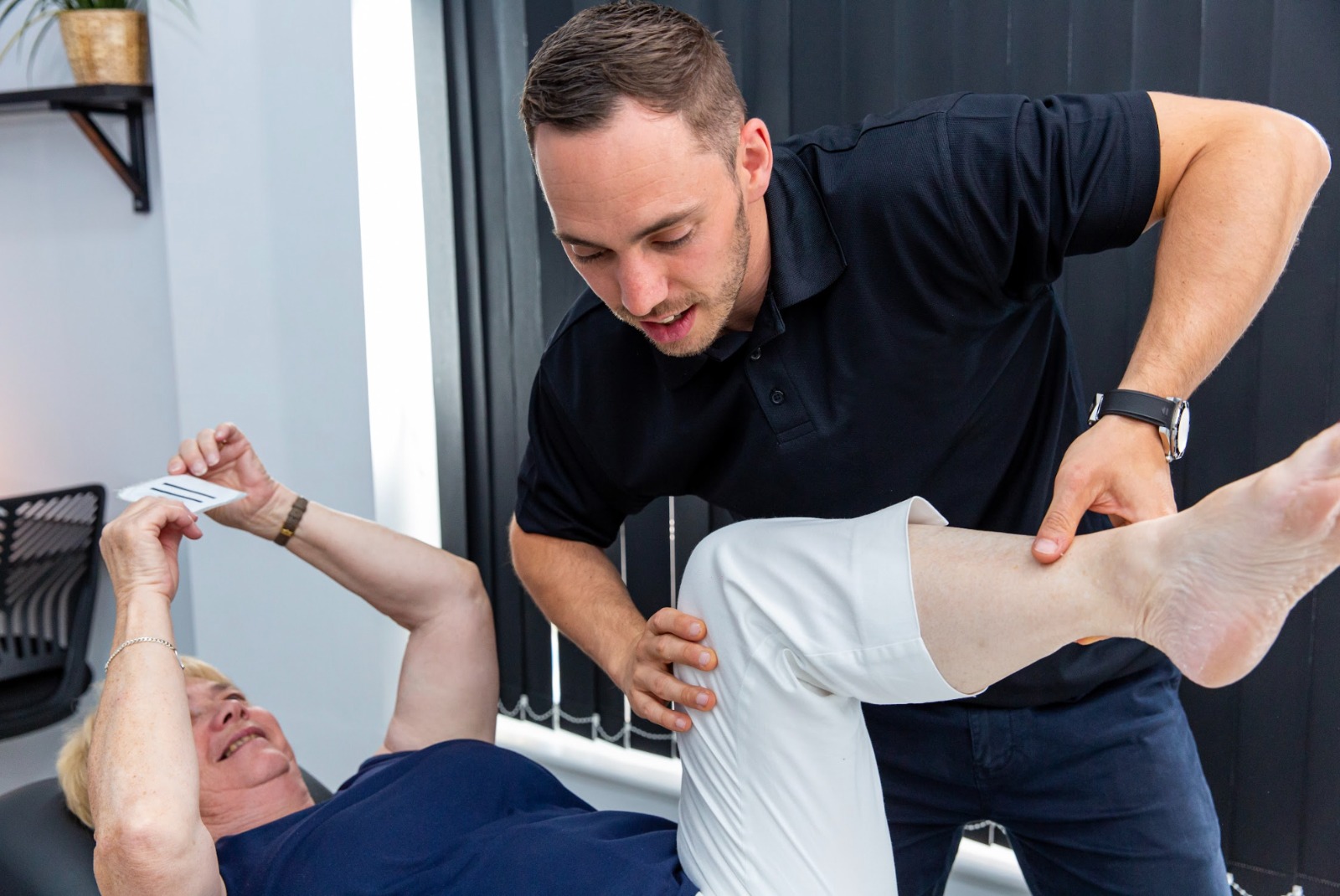 Practitioner providing hands-on manual therapy